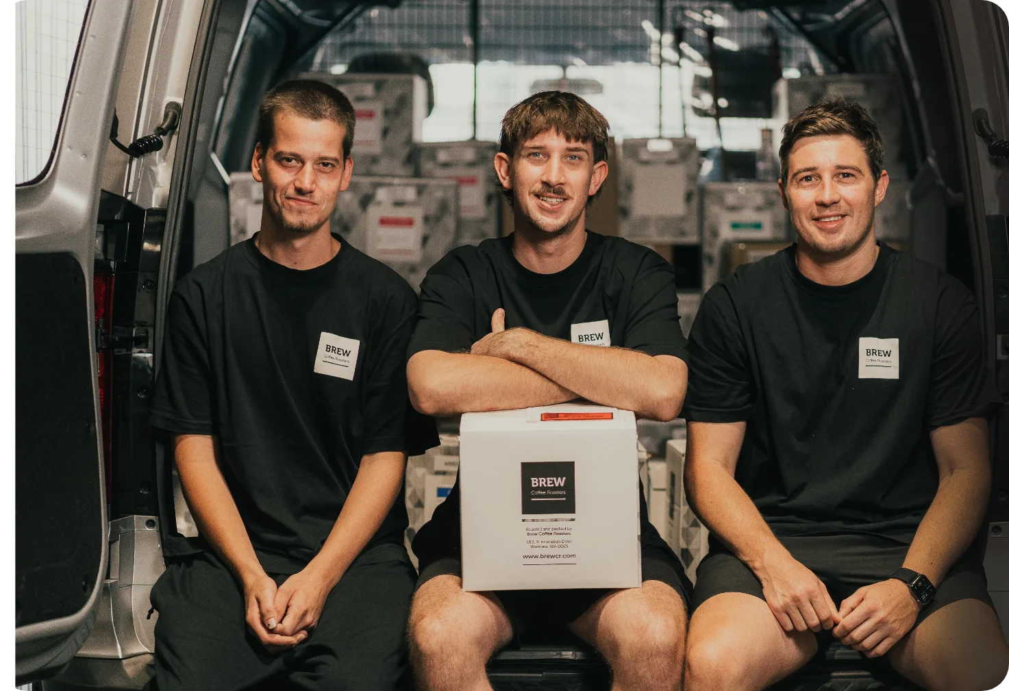 Brew Coffee Roasters Perth Wholesale crew sitting in the back of a van.